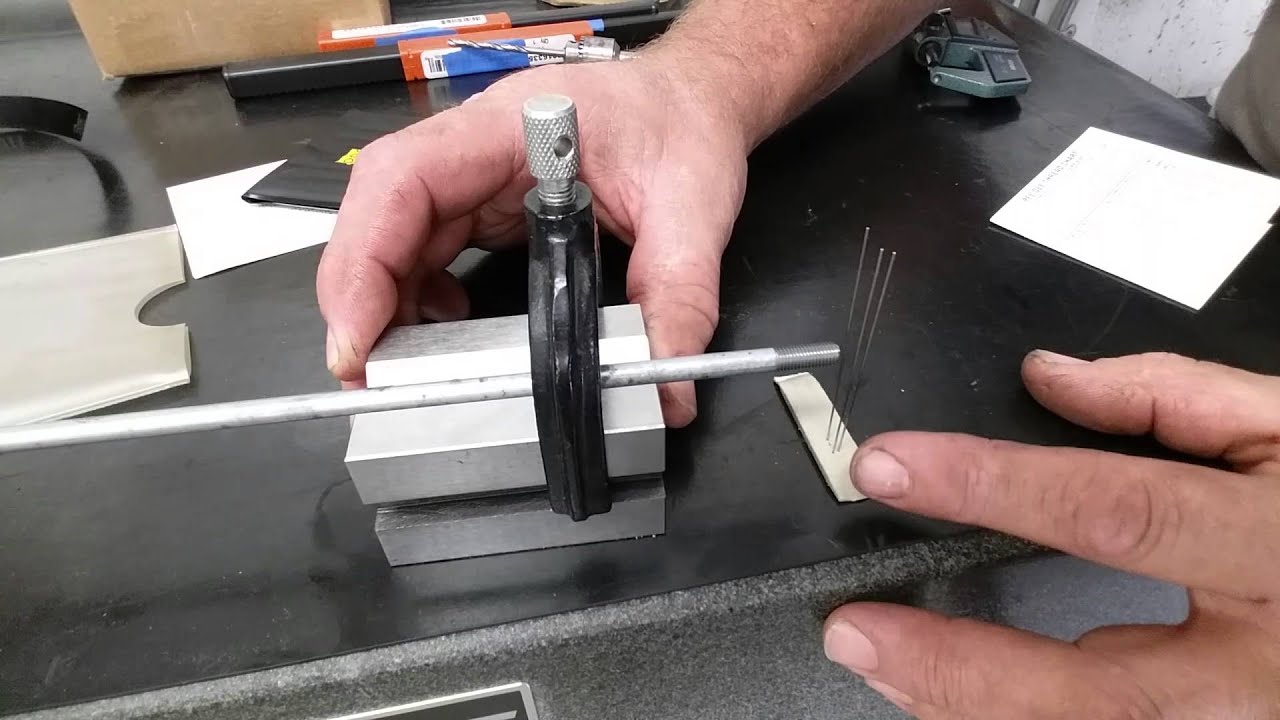 Using the 3 wire method for measuring thread pitch.